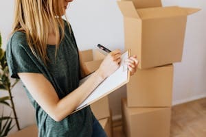 woman creating moving inventory