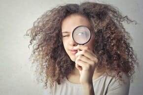 a girl with magnifying glass